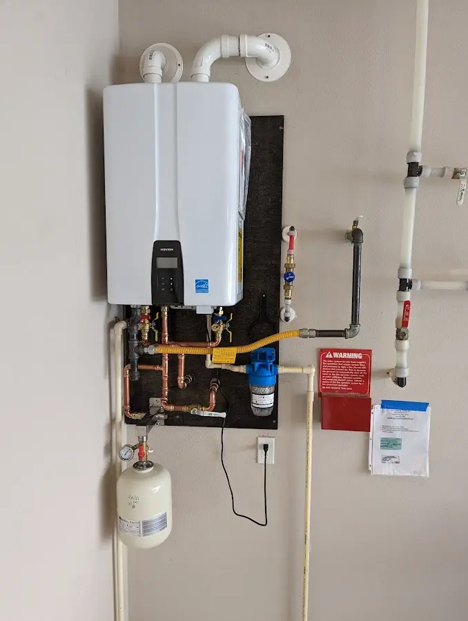 Professional plumber installing copper piping in a Kenilworth home
